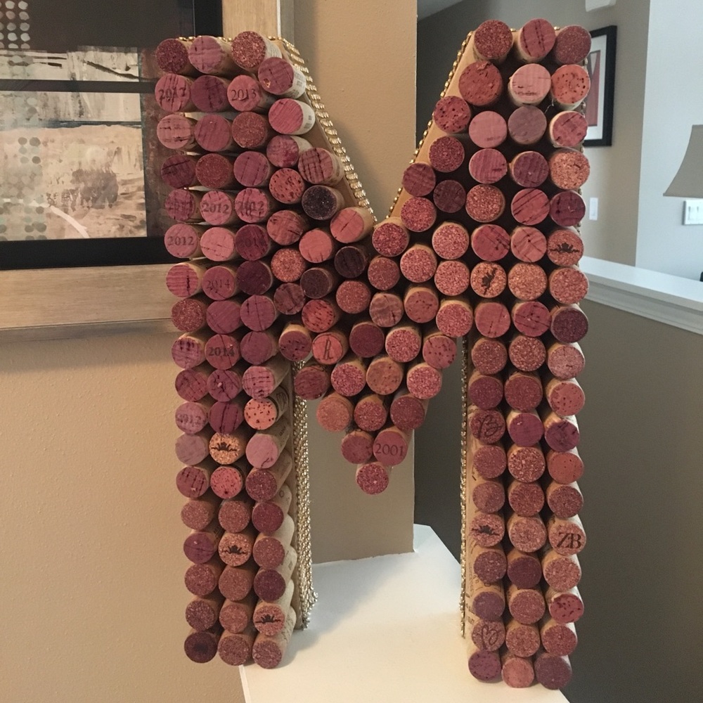 Cork letter “M” with gold and diamond ribbon